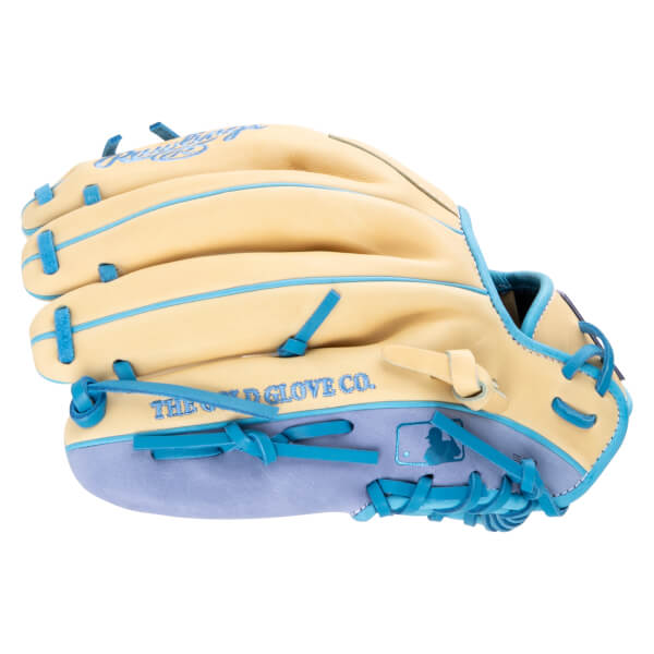 Side view of a tan baseball glove with light blue trim and lacing, showing "THE GOLD GLOVE CO." text.