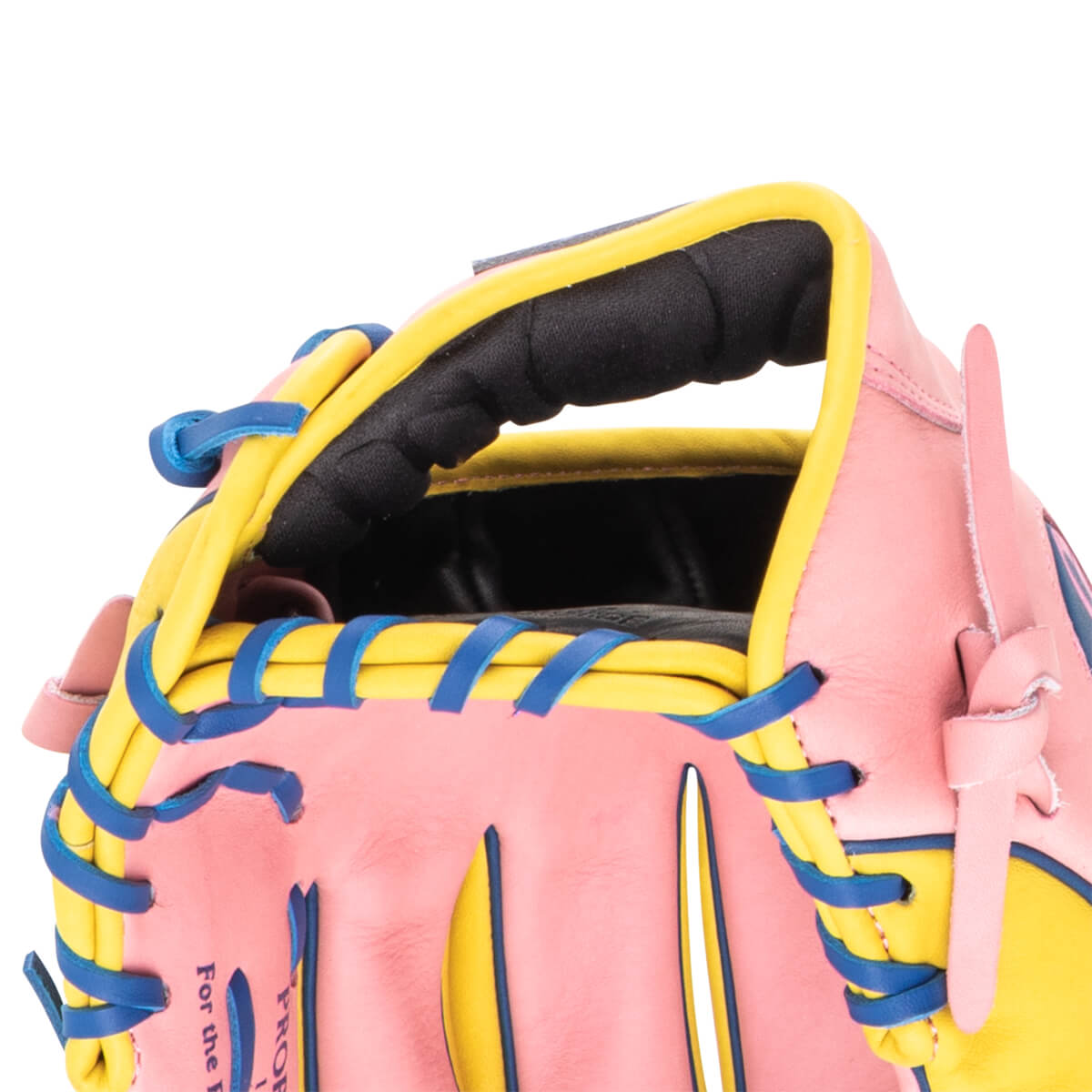 Close-up of a pink baseball glove with yellow and blue lacing, showing the words "For the P" and "PROF".