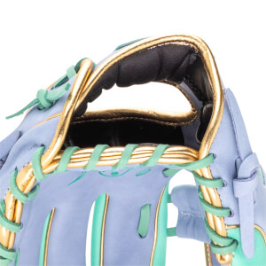 Close-up of a light purple baseball glove with gold trim and mint green lacing.
