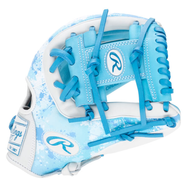 Front view of a light blue and white baseball glove with a splatter pattern, featuring a Rawlings logo and "Est. 1887".
