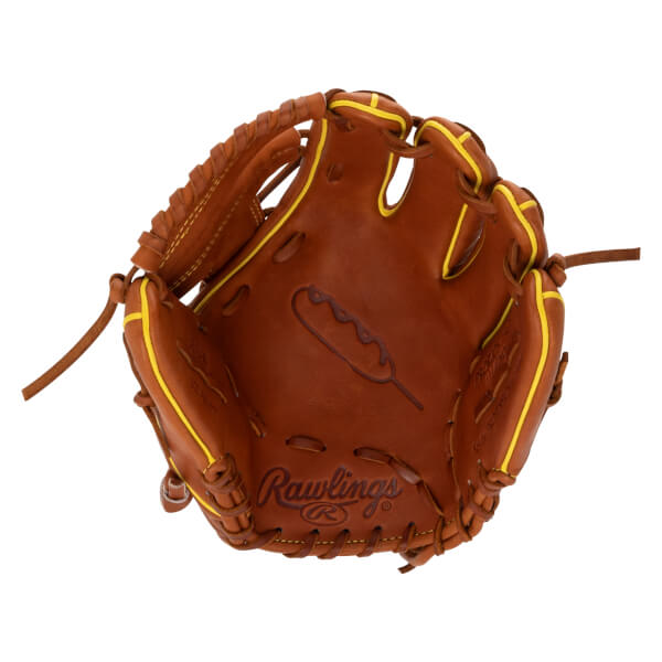 Front view of the brown leather palm showing yellow piping, a corn dog graphic stamped in the center, and the Rawlings logo at the bottom.