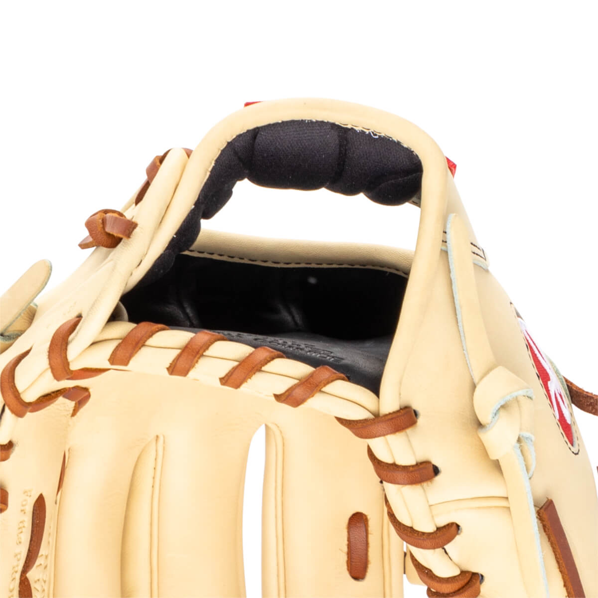 Close-up of a tan baseball glove's interior, showing the padded wrist area and brown lacing.