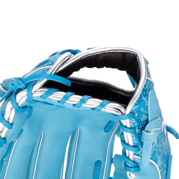 Close-up of a blue baseball glove with a floral pattern, silver lacing, and white trim.