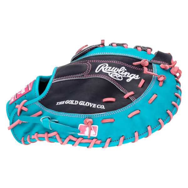 Top-down view of a teal and black Rawlings baseball glove with pink lacing and "The Gold Glove Co." text.