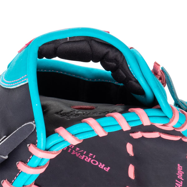 Close-up of a baseball glove showing turquoise binding, pink lacing, and "PROFM12 1/2" text.