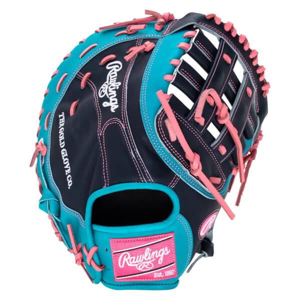 Top-down view of a navy and teal Rawlings baseball glove with pink lacing and a "Rawlings Est. 1887" patch.