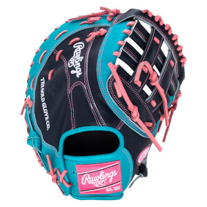 Top-down view of a navy and teal Rawlings baseball glove with pink lacing and a "Rawlings Est. 1887" patch.
