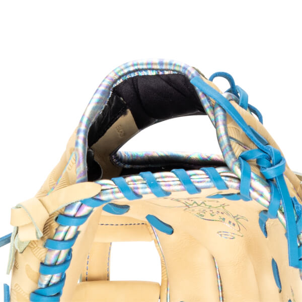 Close-up of a baseball glove showing iridescent trim, blue lacing, and a tan leather palm.