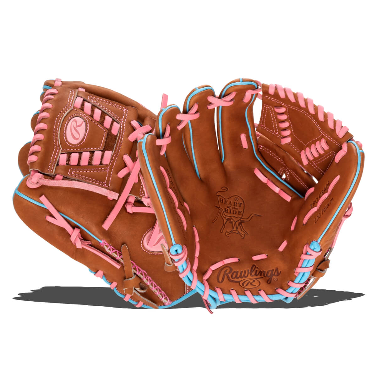 Front view of a brown baseball glove with pink and blue lacing, featuring the Rawlings logo and "Heart of the Hide" branding.