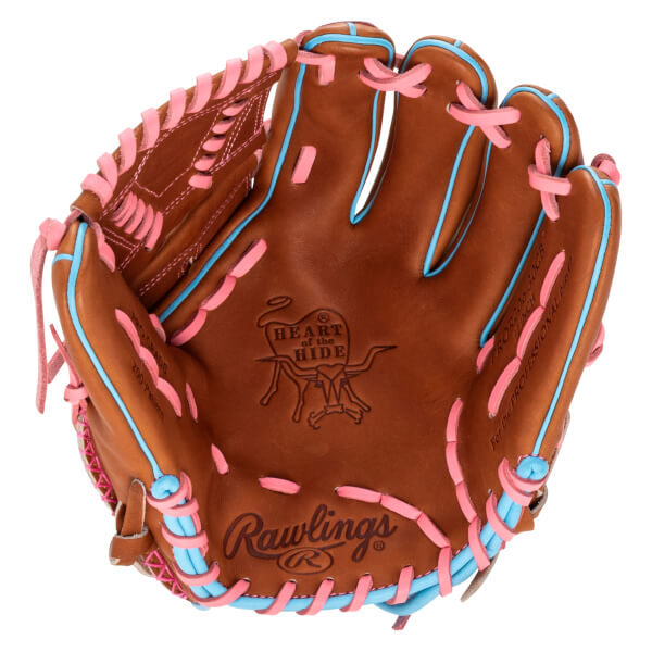 Top-down view of a brown baseball glove with pink and blue lacing, featuring the Rawlings logo and "Heart of the Hide" branding.