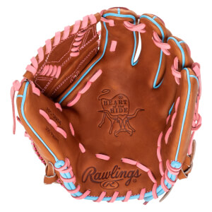 Top-down view of a brown baseball glove with pink and blue lacing, featuring the Rawlings logo and "Heart of the Hide" emblem.