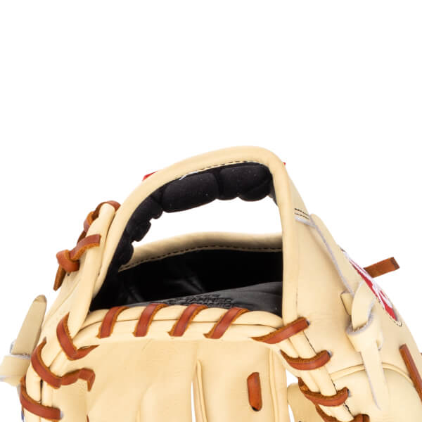 Close-up of the opening of a tan baseball glove, showing the padded wrist area and brown lacing.