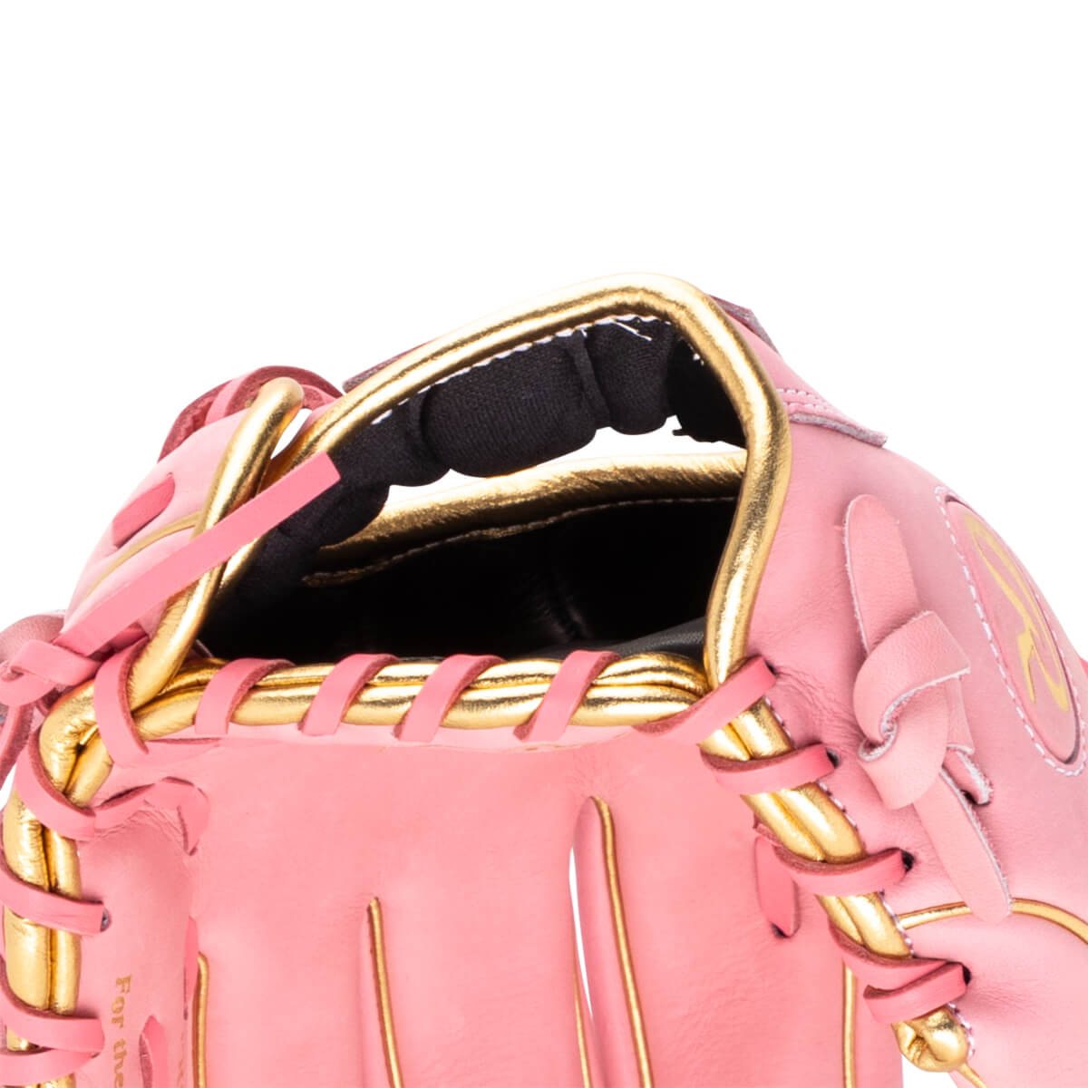 Close-up of a pink baseball glove showing gold lacing and the text "For the".