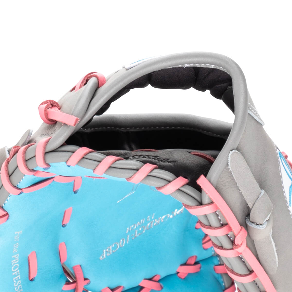 Close-up of a grey baseball glove with bright pink lacing and a turquoise interior, showing the words "For the PROFESSIONAL".