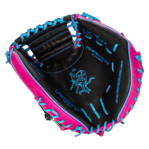 Top-down view of a black baseball glove with pink and blue lacing, showing the "Heart of the Hide" logo and "Rawlings" branding.