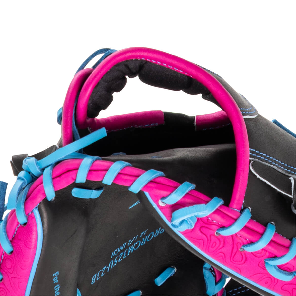 Close-up of a black baseball glove with bright pink and blue lacing, showing the "PROCM325U-23B" model number.