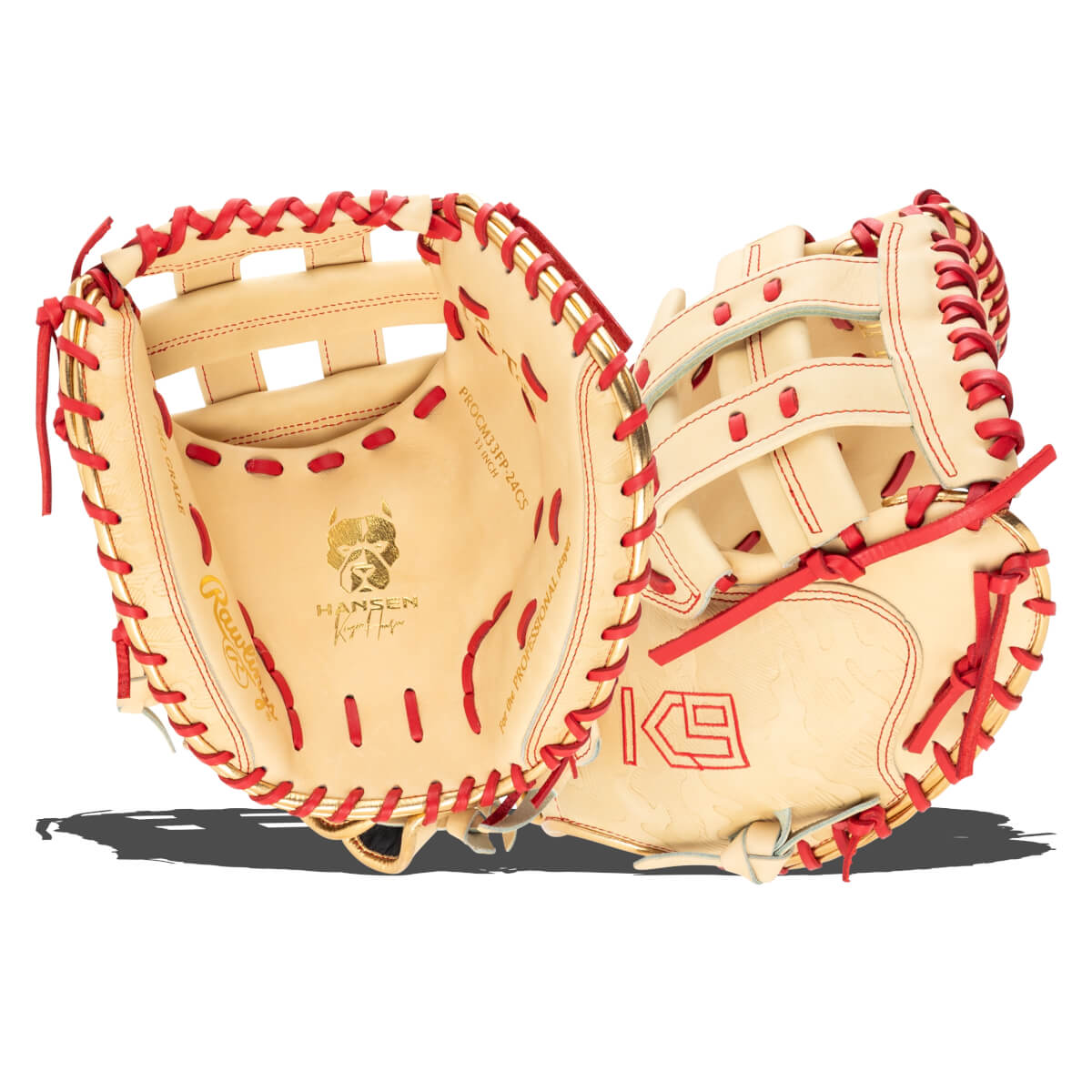 Top-down view of an open tan baseball glove with red lacing and gold accents, showing "Rawlings" and "PROCM33FP-24CS".