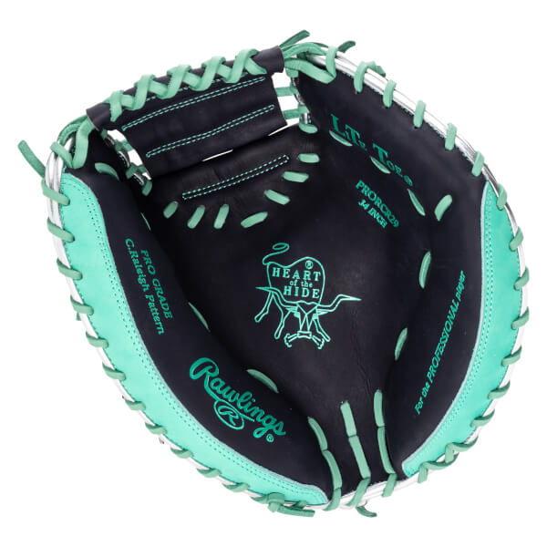 Top-down view of a black baseball glove with mint green lacing, showing the "Rawlings" logo and "Heart of the Hide" emblem.