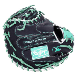 Top-down view of a black baseball glove with mint green lacing, featuring "THE GOLD GLOVE CO." and a Rawlings logo.