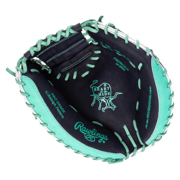 Inside view of a black baseball glove with teal lacing, showing the "Rawlings" logo and "HEART of the HIDE" emblem.