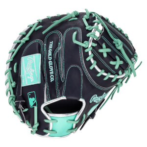 Top-down view of a black baseball glove with teal laces and stitching, featuring "Rawlings" and MLB logos.