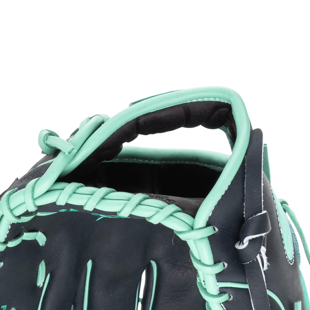 Close-up of a black baseball glove with mint green lacing and trim, showing the thumb and index finger area.