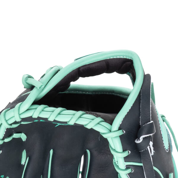 Close-up of a black baseball glove with mint green lacing and trim, showing the thumb and index finger area.