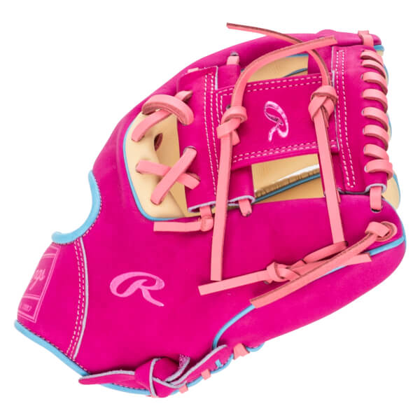 Back view of a bright pink Rawlings baseball glove featuring light blue piping, light pink laces, and a large 'R' logo on the back of the hand.