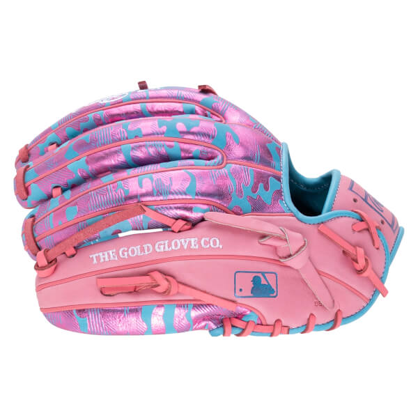 Back view showing a metallic pink and blue camo shell, pink laces, and the text “THE GOLD GLOVE CO.” and the MLB logo on the pink leather thumb.
