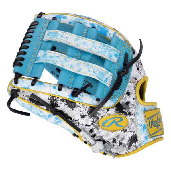 Side view of the glove featuring white leather with blue and black paint splatters, a light blue H-web, and yellow patches with the "R" and Rawlings brand logos.