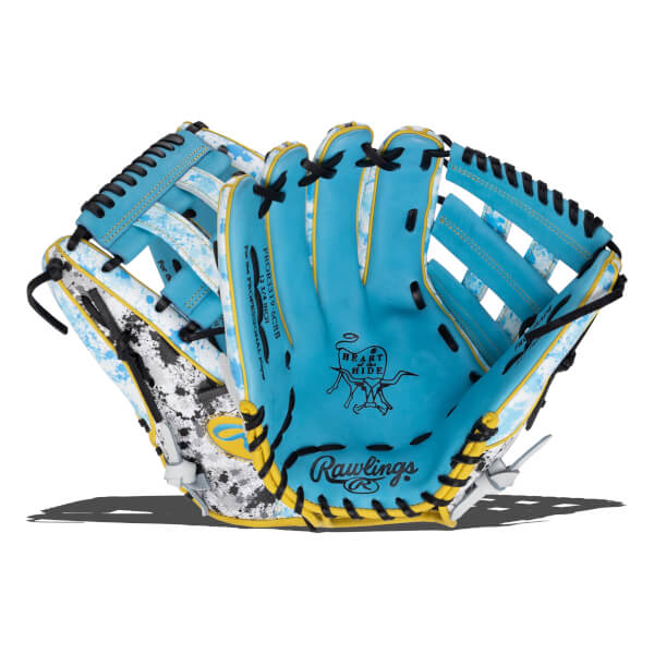 Front view of a light blue baseball glove featuring “HEART of the HIDE” and “Rawlings” text, accented by black laces and a white and blue paint-splatter patterned shell.