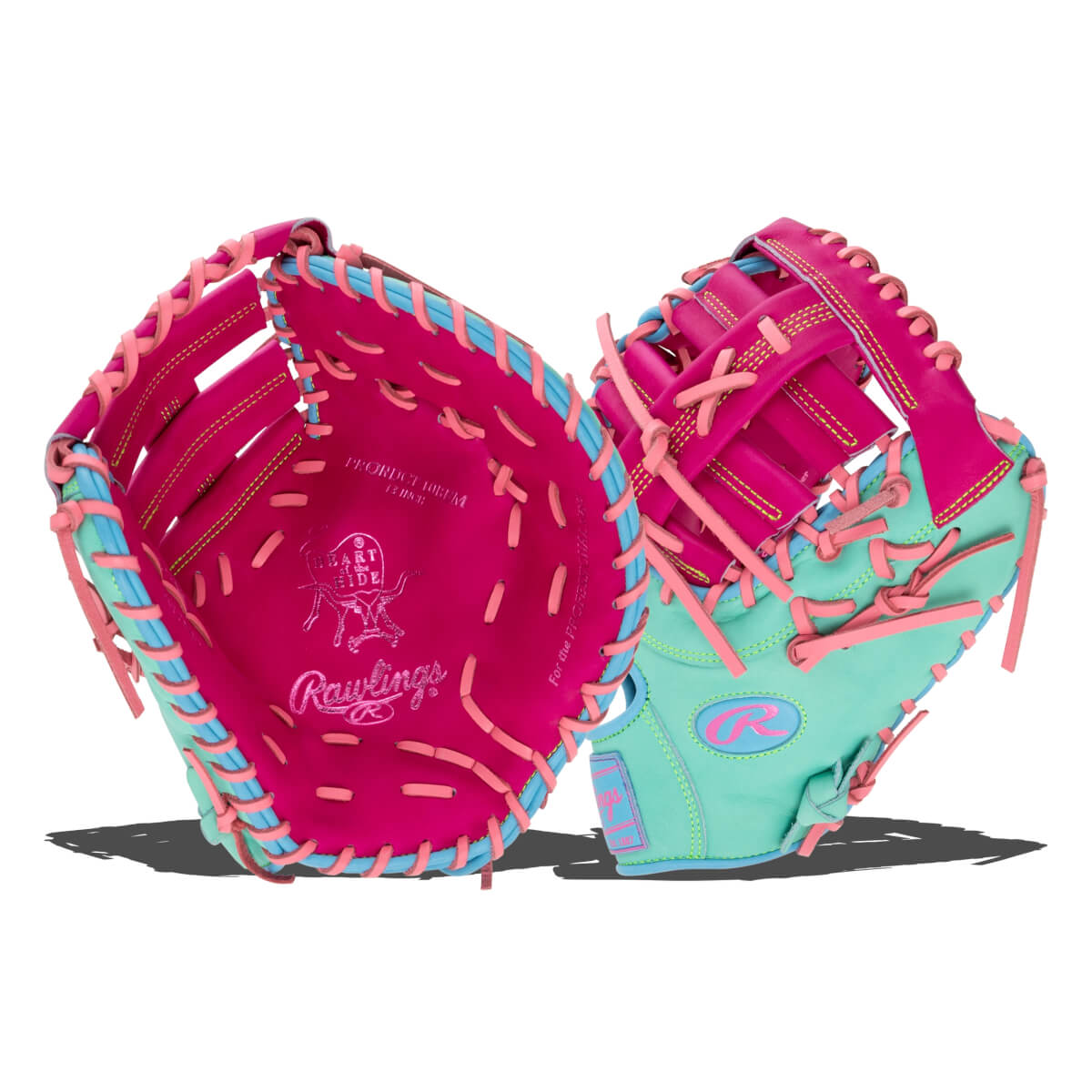 Front and back views of a hot pink and mint green leather first base mitt with pink laces, featuring the "Rawlings" and "HEART of the HIDE" logos.