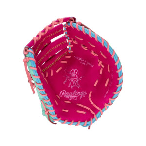 Front interior view of a pink first base mitt with light blue trim, pink laces, and the embossed "Rawlings" and "HEART of the HIDE" logos.