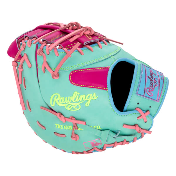 Back view of a teal first base mitt featuring pink laces and "Rawlings" in neon yellow on the shell and on a pink and blue wrist patch.