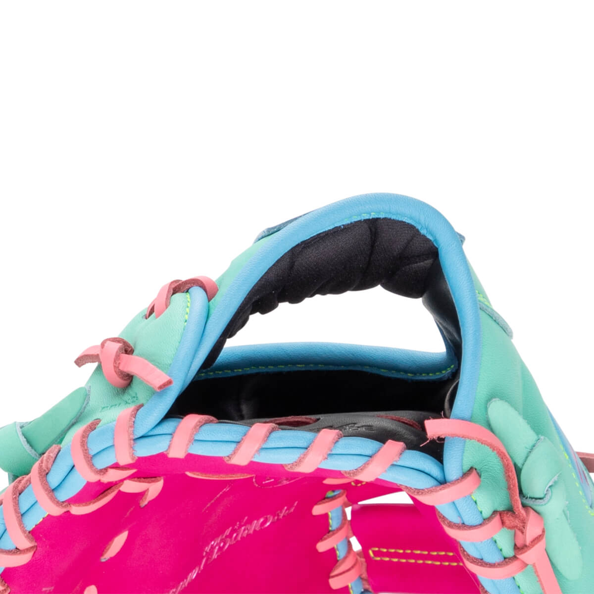 Close-up of the wrist opening features teal and bright pink leather with blue trim, pink laces, and a black padded interior with "Rawlings" script on the palm.