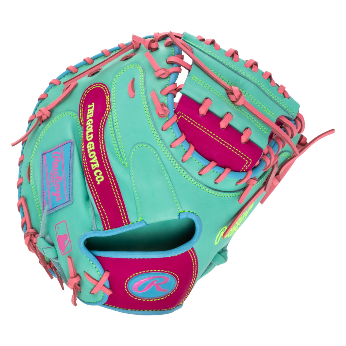 Back view of a mint green catcher's mitt with hot pink and blue accents, featuring "THE GOLD GLOVE CO." text and a pink Rawlings "R" logo on the wrist strap.