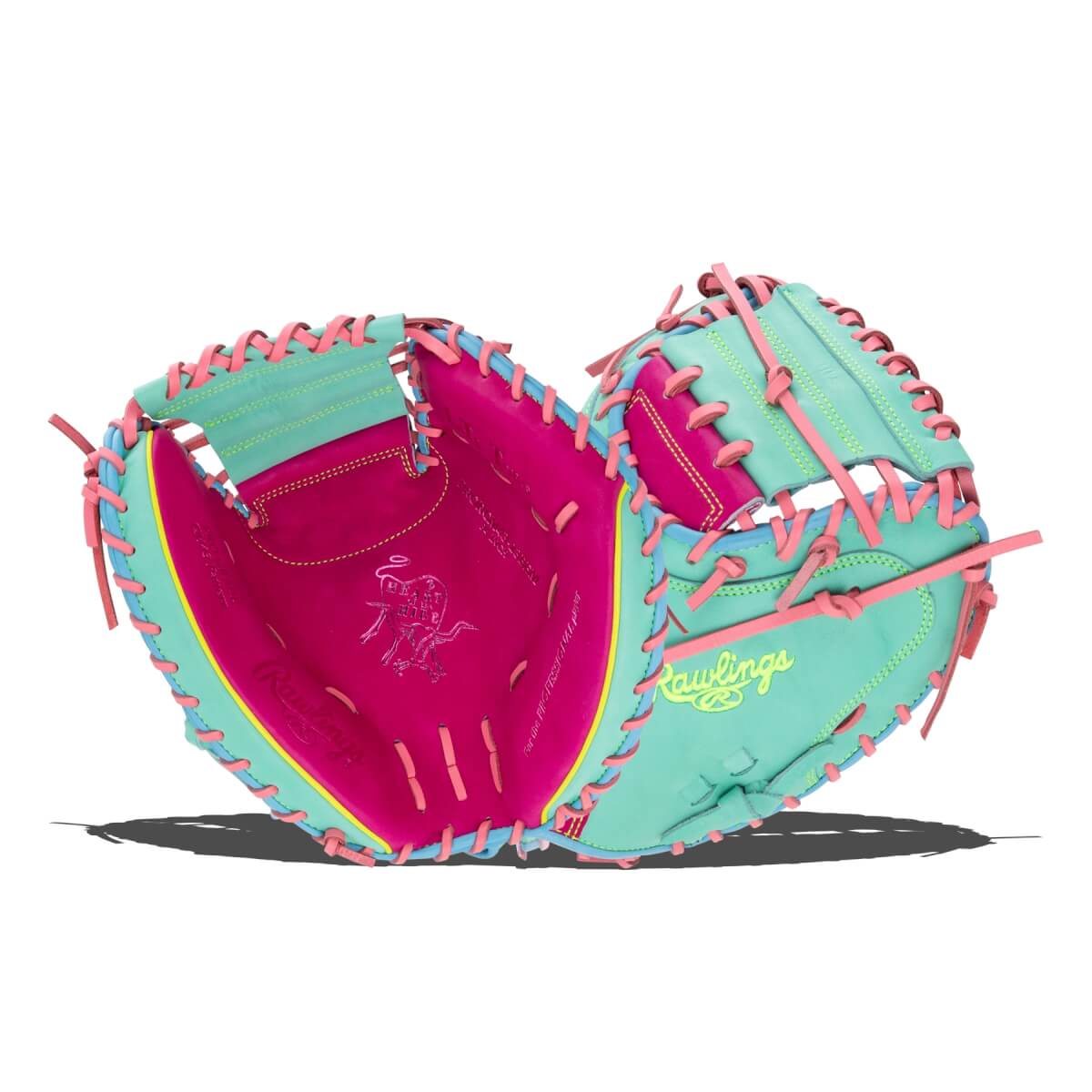 Front and back views of a teal and hot pink mitt with pink laces, featuring the "Rawlings" script and "Heart of the Hide" bull logo.
