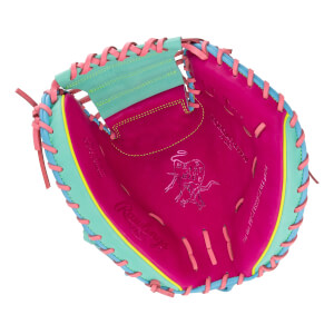 Front view of a 34-inch catcher's mitt with a pink palm, mint green trim, and blue and pink laces, featuring stamped Rawlings and Heart of the Hide logos.