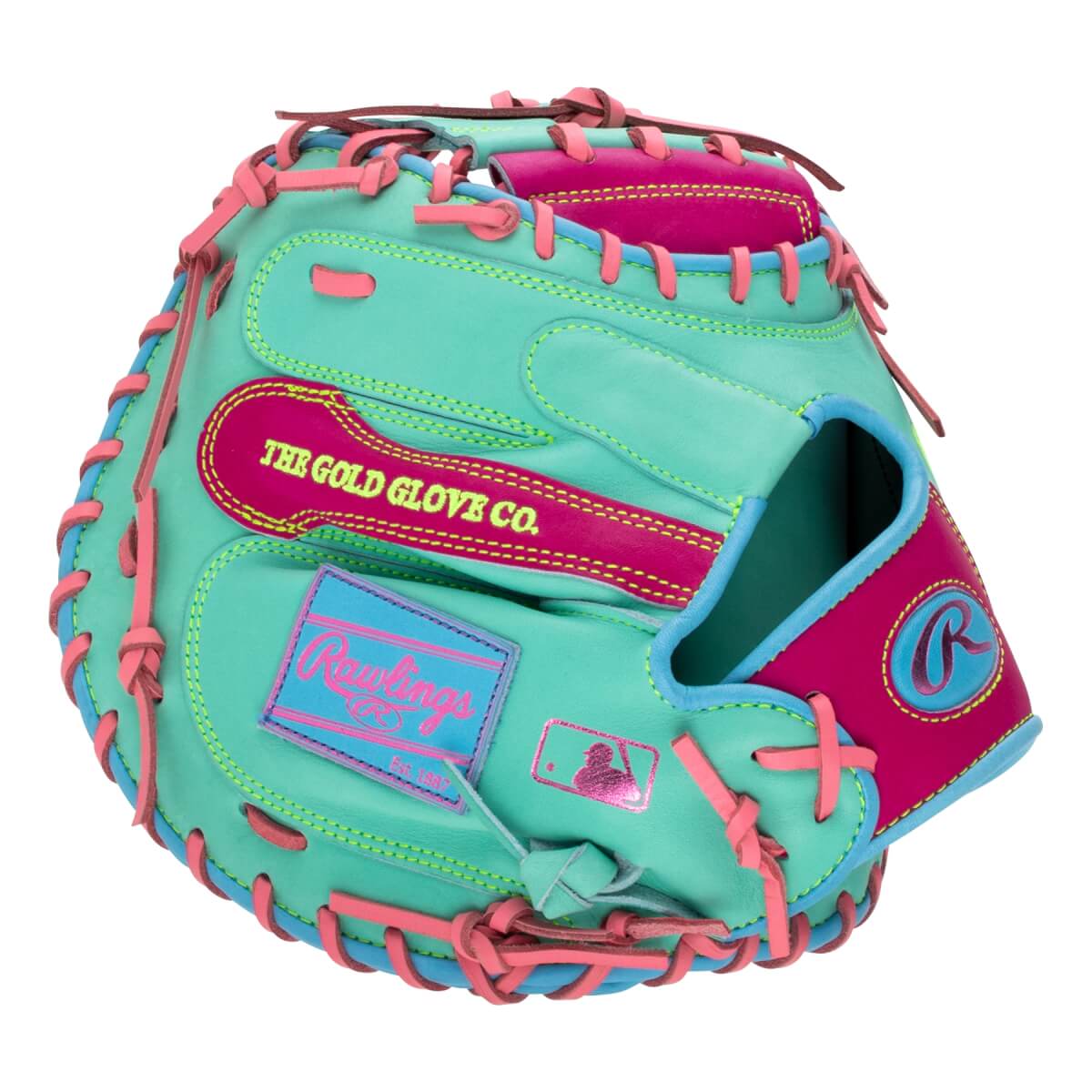 Back view of a mint green catcher's mitt with pink lacing and "THE GOLD GLOVE CO." and "Rawlings" branding in hot pink, light blue, and yellow.