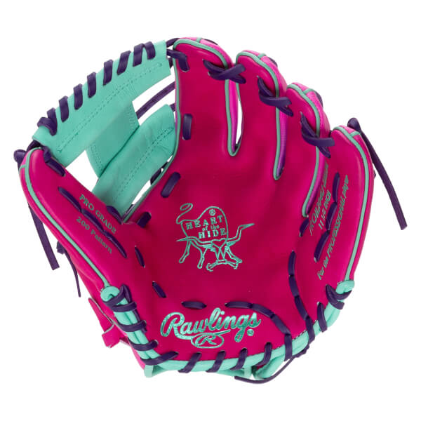 Front view of a pink baseball glove with teal and purple accents, showing the Rawlings logo and "Heart of the Hide" emblem.