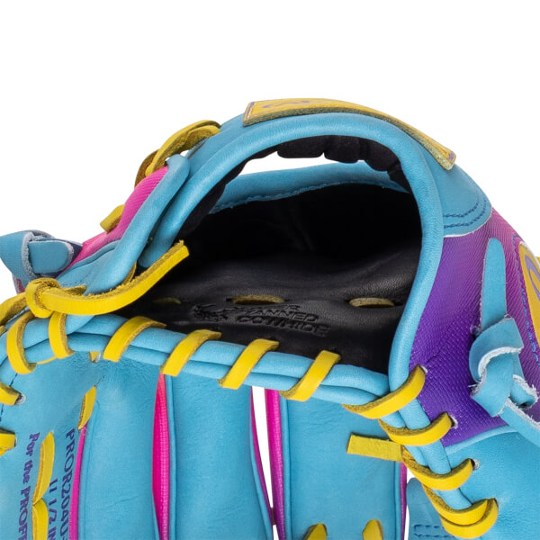 Close-up of a blue baseball glove with yellow lacing, pink accents, and purple detailing.