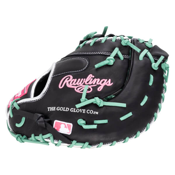 Front view of a black baseball glove with pink Rawlings logo, mint green lacing, and MLB logo.