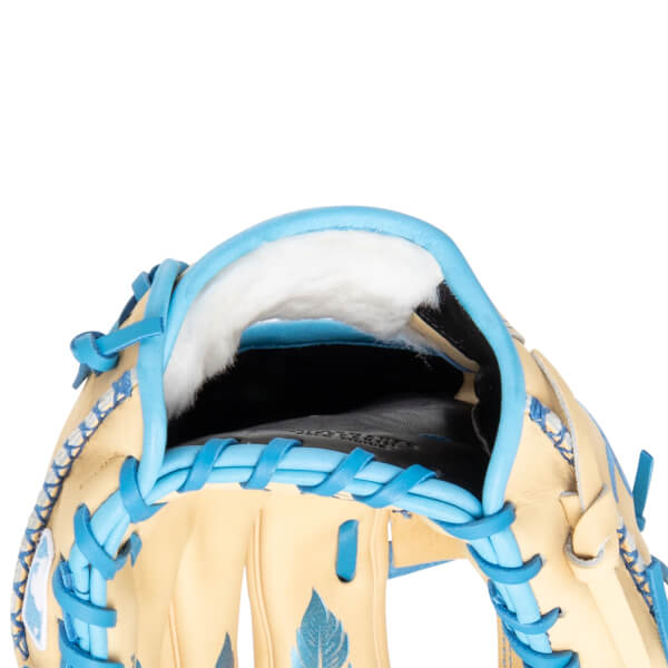 Close-up of the inside of a baseball glove showing tan leather, blue lacing, and white padding.