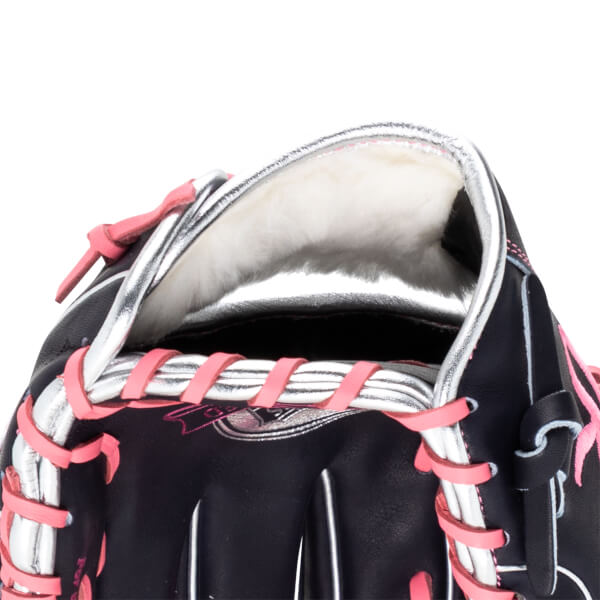 Close-up of a black baseball glove with pink lacing and a silver trim.