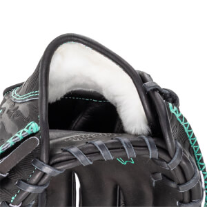 Close-up of a black baseball glove's interior, showing white padding and teal stitching.