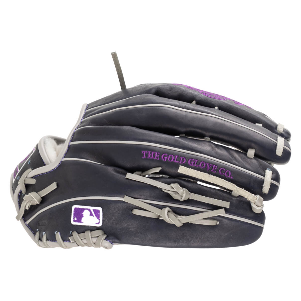 Side view of a dark navy baseball glove with purple stitching, white piping, and "THE GOLD GLOVE CO." text.