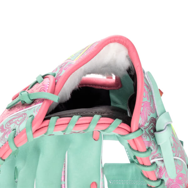 Close-up of a baseball glove's interior showing pink trim, white lining, and a teal and pink swirl pattern.
