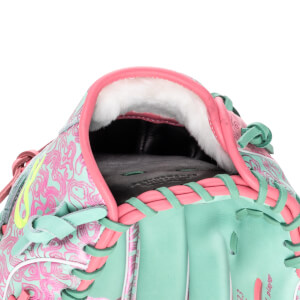 Close-up of the inside of a baseball glove, showing white padding, pink trim, and a teal exterior with a pink swirl pattern.