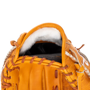 Close-up of the top opening of a baseball glove, showing tan leather, white fur lining, and brown lacing.