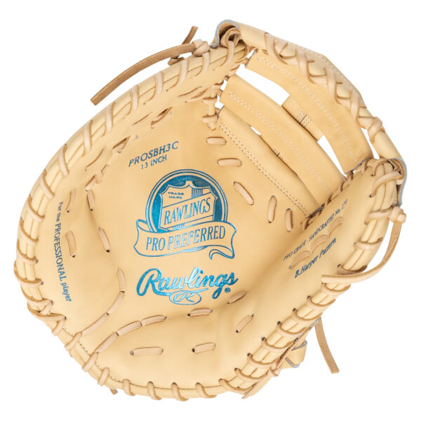 Top-down view of a tan Rawlings Pro Preferred baseball glove with blue lettering and "B. Harper Pattern" visible.